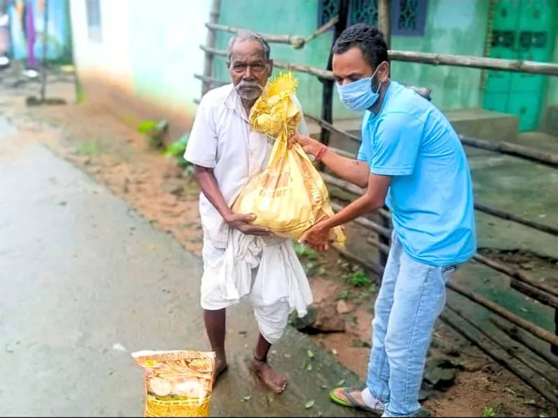 PlanCare volunteers distributing dry ration kits in rural India