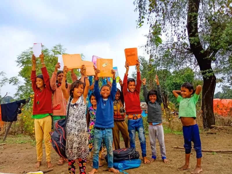 Children with new stationery kits from PlanCare