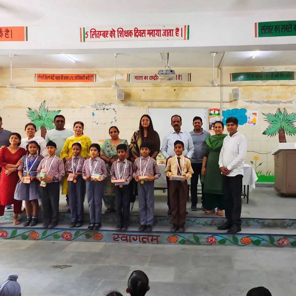Rural school students receiving stationery kits