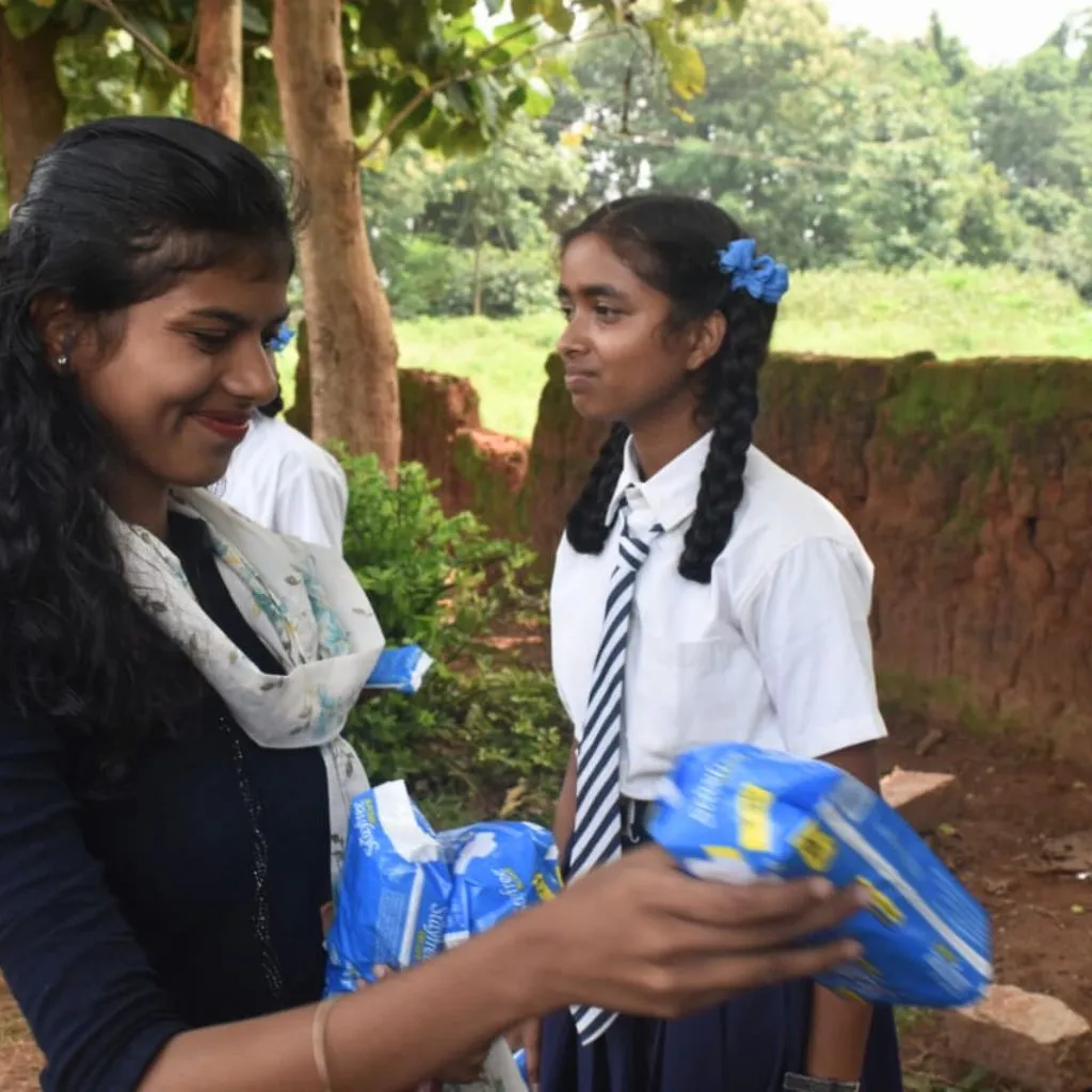 Menstrual hygiene kit distribution by PlanCare in village school