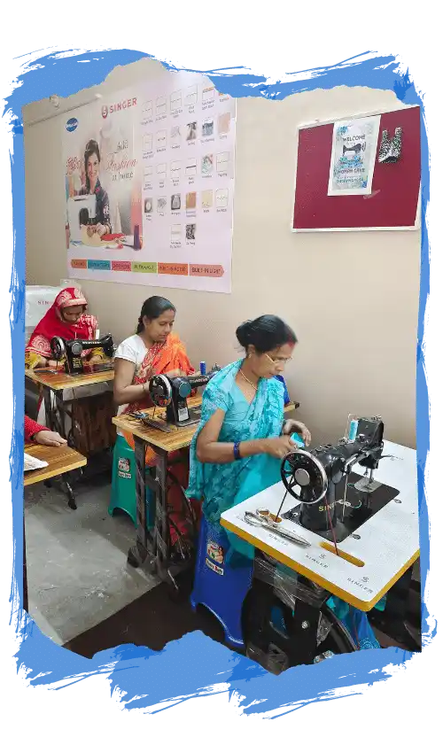 Women sewing garment in training center
